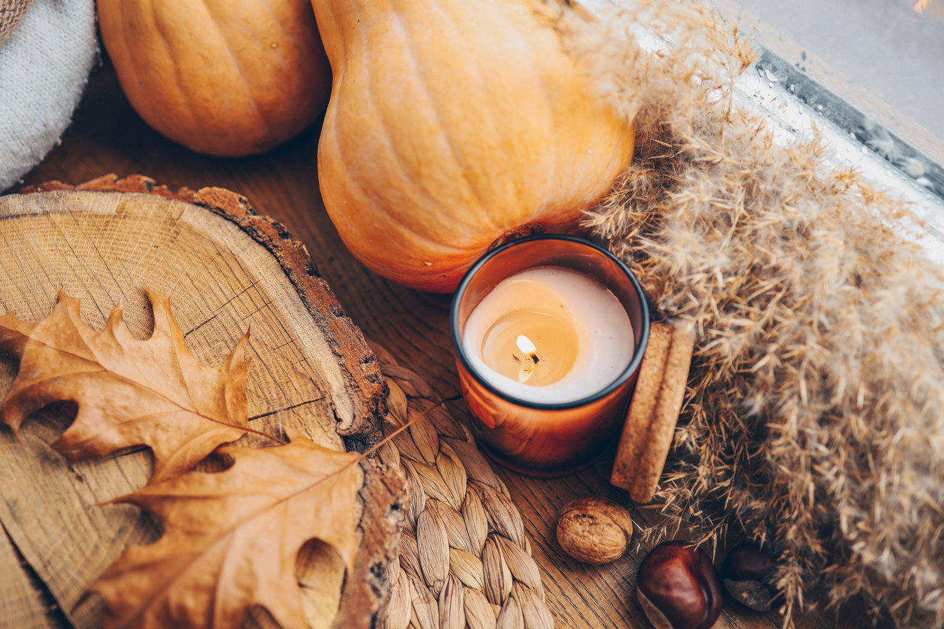 Burning candle and autumn decor, home decor aesthetics